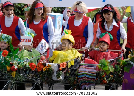 ULAN-UDE, RUSSIA - SEPTEMBER 6: Unidentified employees (and their children) of the supermarket trading network \