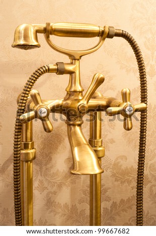 a bronze (brass) mixer tap in retro style