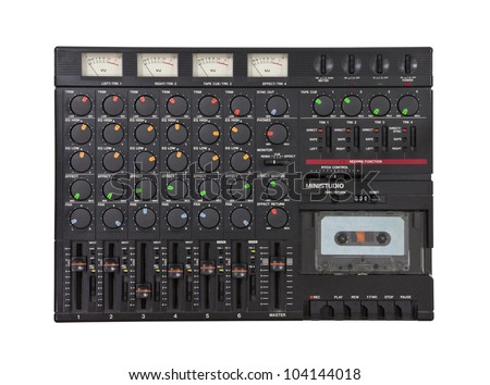 Vintage sound mixing board and cassette recording device isolated.
