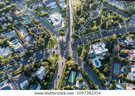 Aerial view of six way intersection at N Beverly Drive, N Canon Drive and Lomitas Ave in Beverly Hills, California.
