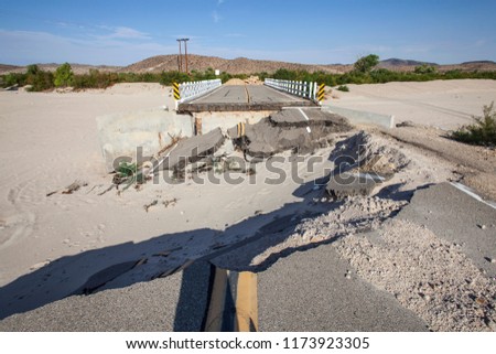 Flood damaged closed highway road and bridge in the Mojave desert near Barstow, California.