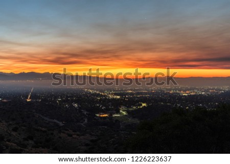 Los Angeles, California, USA - November 10, 2018:  Smoke filled dawn sky above the San Fernando Valley.  Smoke is from the Woolsey fire in Malibu and Ventura County.