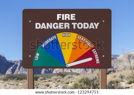 Extreme fire danger today sign with Mojave desert background