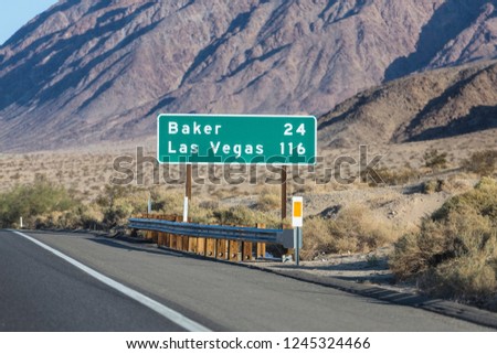 Las Vegas 116 miles highway sign on Interstate 15 near Baker in the Mojave Desert area of Southern California.