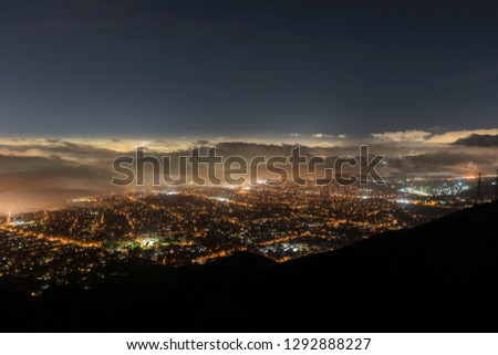 Aerial night view of fog over Los Angeles, Pasadena and Glendale in Southern California.