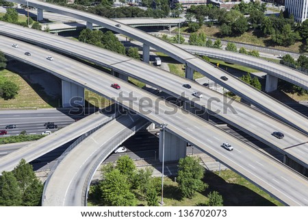 Sprawling suburban freeway interchange aerial in Atlanta Georgia.