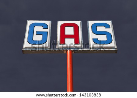 Old isolated gas sign with desert thunderstorm sky.