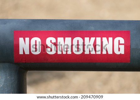 No smoking sign on mountain park gate.
