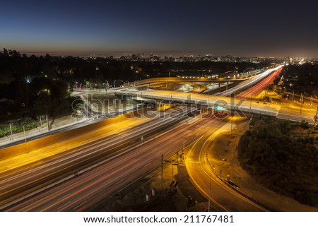 Dawn glow above the San Diego 405 Freeway at Sunset Blvd in Los Angeles, California.