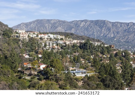 Upscale Los Angeles County hillside homes with San Gabriel mountains backdrop.
