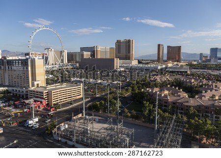 LAS VEGAS, NEVADA, USA - June 10, 2015:  Clear desert morning view of resort casino towers and the High Roller ferris wheel attraction.