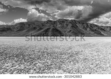 Mojave desert dry lake salt flat black and white.