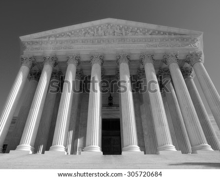 Historic US Supreme Court building in black and white.
