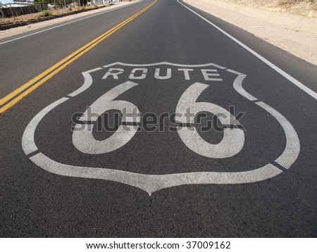 Route 66 sign painted onto the road pavement.