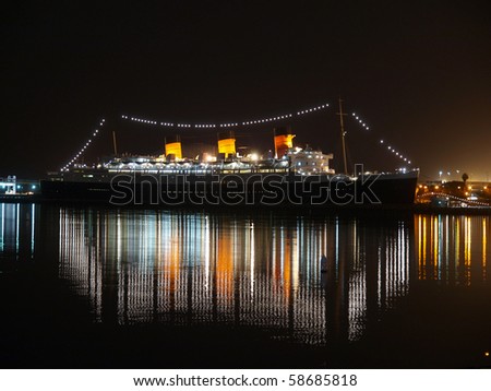 LONG BEACH CALIFORNIA - FEBRUARY 10:  Historic Queen Mary shines brightly at night February 10, 2009 in Long Beach, California.