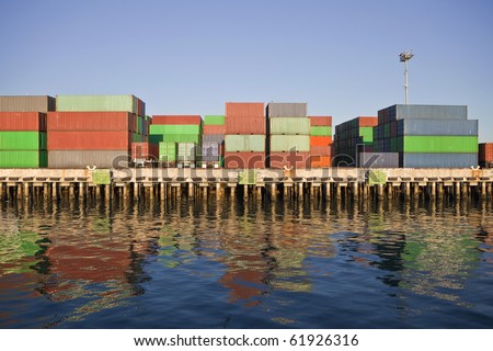 stock-photo-cargo-containers-and-dockside-trailers-in-warm-afternoon-light-61926316.jpg