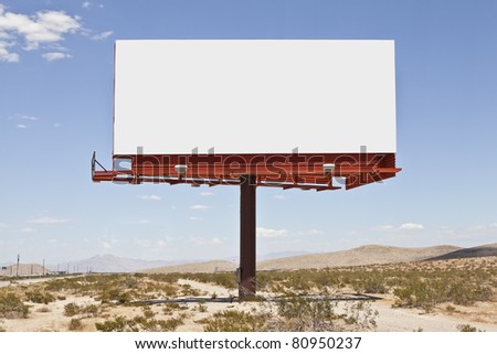 Big, blank billboard in the middle of the Mojave desert.