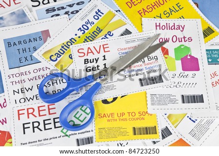 Completely fake fashion coupons with scissor.  Fictional bar codes.  All coupons were created by the photographer.  No real ads were used.  Photographs in the coupons are the photographers work.