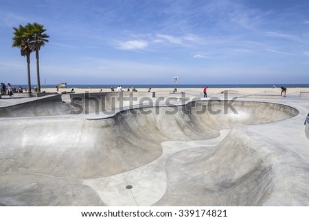 LOS ANGELES, CALIFORNIA , USA - June 20, 2014:  Concrete ramps and ocean views at the popular Venice beach skateboard park in Los Angeles, California.