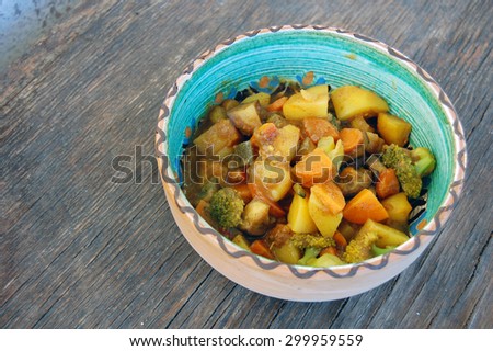 closeup of Indian meal. fresh seasonal vegetables with curry sauce