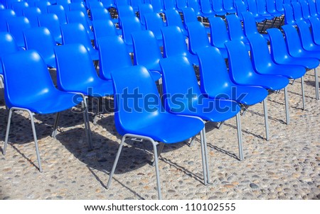 View of Empty blue chairs for outdoor cinema