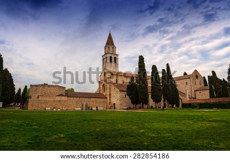 View of Basilica di Santa Maria Assunta and bell tower of Aquileia, Italy. Aquileia is UNESCO World Heritage Site