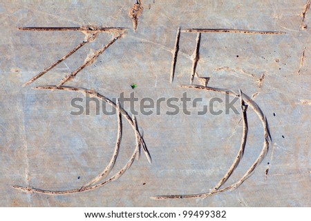 Photo of Numbers etched in stone
