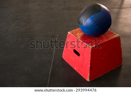 Red jump box with a navy and black medicine ball