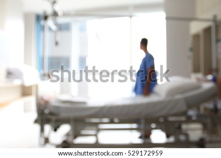 Male patients stand on bed and relax in the Hospital Room