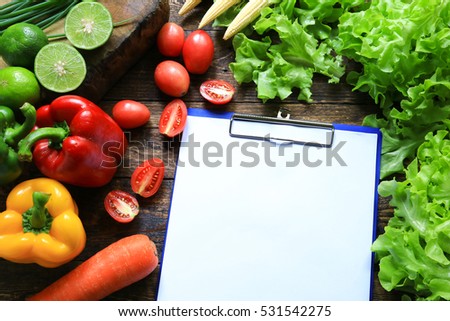 Include fresh organic vegetables basket on wooden floor with copy space still life