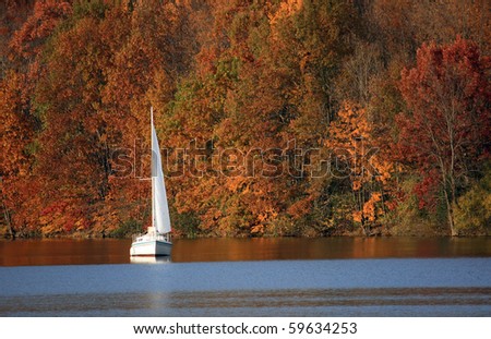Sailboat on a lake in autumn