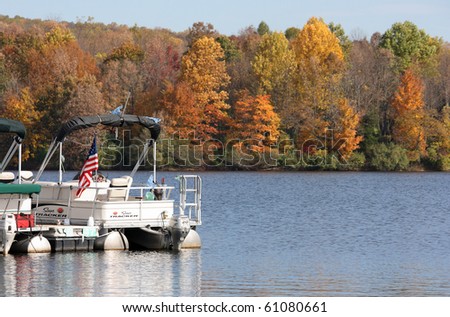Sailing boat in the lake in autumn