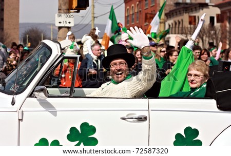 SCRANTON, PA - MARCH 14: A man waves from a decorated car during the Scranton St. Patrick\'s Day parade on March 14, 2009. Scranton holds one of the largest parades in the United States.