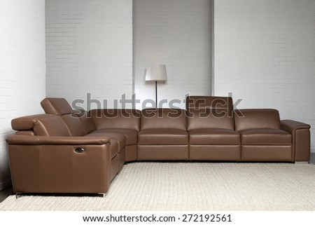 Corner brown sofa with headrest up