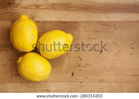 Lemons isolated on wood background