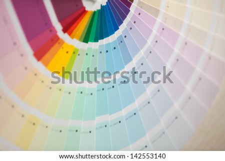 covered in white on a rainbow color card
