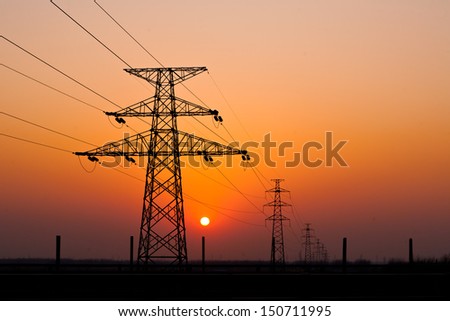 Sunset Under The High-Voltage Tower In The Background