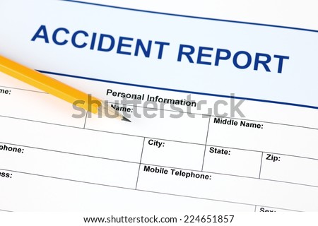 Accident report application form with pencil.