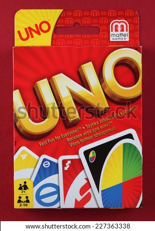 Tambov, Russian Federation - August 15, 2013: Box of UNO game on red background. Uno is an American card game which is played with a specially printed deck. The deck consists of 108 cards.