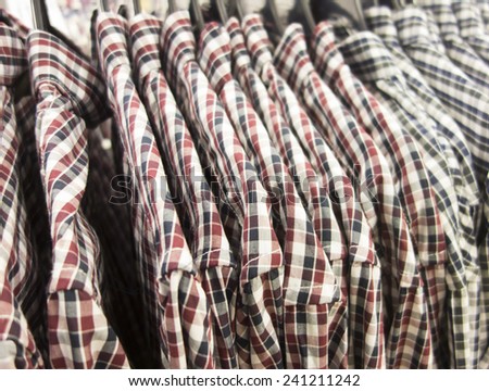 Plaid shirts on shoulders in the store