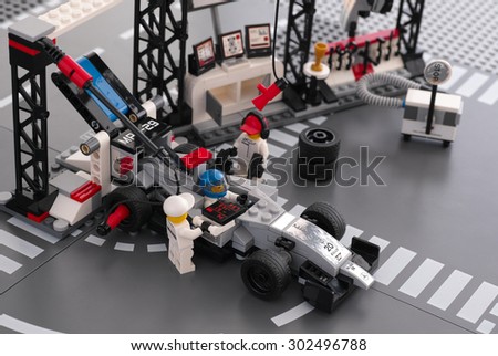 Tambov, Russian Federation - June 24, 2015 MP4-29 race car in McLaren Mercedes Pit Stop by LEGO Speed Champions with fully equipped convertible pit stop. Studio shot.