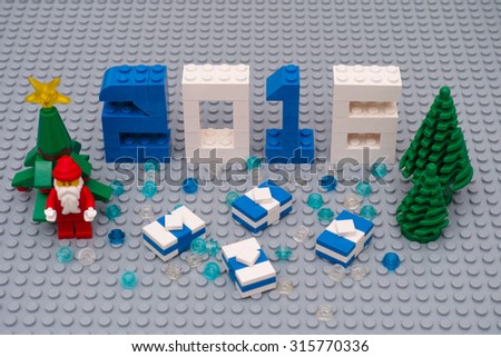 Tambov, Russian Federation - September 03, 2015 New year 2016 concept by Lego. Numbers 2016, christmas trees, Santa Clause and presents on Lego baseplate. Custom scene. Studio shot.