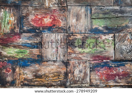 Vintage style, painted in various colors, old damaged teakwood table board with rough surface of wood texture, cracks, grain. Natural material backgrounds and teak furniture manufacturing in Indonesia