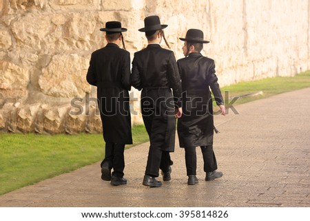 JERUSALEM, ISRAEL - NOV 23, 2013: Jewish kids walking outside Jerusalem Walls.