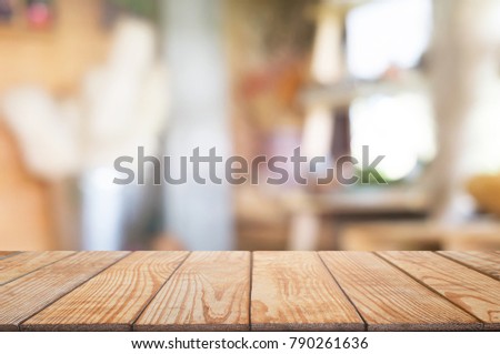 empty wooden table with blurred montage coffee shop cafe / restaurant background