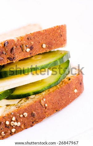 Section of cheese and cucumber sandwich wholemeal bread
