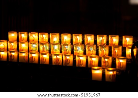 Serene views of Church candles in detail isolated on black
