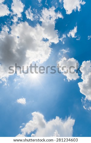 Rays of sun light from the sun on the beautiful blue sky with th