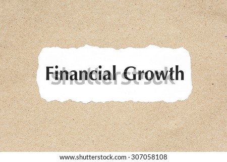 Financial growth word on white ripped paper on brown document texture