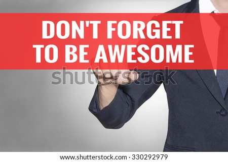 Business man Dont Forget to Be Awesome word touching on red tab virtual screen for business concept